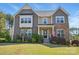 Beautiful two-story home featuring stone and shingle siding, manicured lawn, and an inviting front porch at 16831 Alydar Commons Ln, Charlotte, NC 28278
