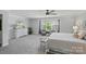 Comfortable main bedroom with plush carpet, sitting area, and large windows at 16831 Alydar Commons Ln, Charlotte, NC 28278