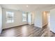 Bright and airy bedroom with hardwood floors and large windows that provide ample natural light at 1711 Wooten Way, Bessemer City, NC 28016