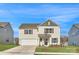 Charming two-story home boasts a manicured lawn, two-car garage, and classic architectural details at 1711 Wooten Way, Bessemer City, NC 28016