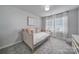 Cozy bedroom with neutral walls, a comfortable daybed, and bright natural light at 177 Briana Marie Way, Indian Trail, NC 28079