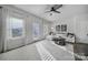 The living room features large windows, a plush sectional sofa, stylish decor, and ample natural light at 177 Briana Marie Way, Indian Trail, NC 28079
