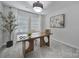 Bright office space with a modern desk, light-colored walls, and plenty of natural light at 177 Briana Marie Way, Indian Trail, NC 28079