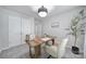 Well-lit home office with a modern desk, plush carpeting, and a decorative plant at 177 Briana Marie Way, Indian Trail, NC 28079