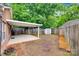 Spacious backyard featuring a covered patio, storage shed, and a privacy fence at 1866 Charter Dr, Rock Hill, SC 29732