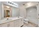 Bright bathroom features a double vanity, a large mirror and combined tub and shower at 1866 Charter Dr, Rock Hill, SC 29732
