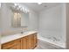Bathroom featuring a soaking tub, vanity with lots of storage, and updated fixtures at 1866 Charter Dr, Rock Hill, SC 29732