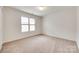 Neutral bedroom with carpet and large window providing ample natural light at 1866 Charter Dr, Rock Hill, SC 29732
