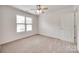 Inviting bedroom with ceiling fan, window, and neutral carpet at 1866 Charter Dr, Rock Hill, SC 29732