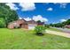 Charming brick home with a well-manicured lawn and an attached two-car garage at 1866 Charter Dr, Rock Hill, SC 29732