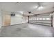 Spacious garage with overhead door, storage shelves and ample room for vehicles at 1866 Charter Dr, Rock Hill, SC 29732