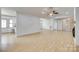Large living space with laminate flooring, a ceiling fan and ample room for entertaining at 1866 Charter Dr, Rock Hill, SC 29732