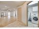 Open living area with laminate flooring, leading to the laundry room and featuring a vaulted ceiling at 1866 Charter Dr, Rock Hill, SC 29732