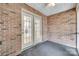Covered brick patio with neutral carpeting and glass french doors at 1866 Charter Dr, Rock Hill, SC 29732