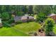 Picture perfect backyard with green lawn, flower beds, and beautiful landscaping at 1940 12Th Ne St, Hickory, NC 28601