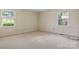 Bedroom with neutral carpet and trim, offers a bright and airy atmosphere with natural light at 1940 12Th Ne St, Hickory, NC 28601
