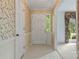 Inviting foyer with patterned wallpaper, ceramic tile floor, and white door at 1940 12Th Ne St, Hickory, NC 28601