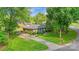 Charming brick ranch with mature landscaping, a well-manicured lawn, and spacious driveway at 1940 12Th Ne St, Hickory, NC 28601