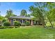Charming brick ranch home with manicured lawn and mature trees at 1940 12Th Ne St, Hickory, NC 28601