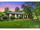 Charming one-story brick home with lush green lawn and landscaping, inviting curb appeal at 1940 12Th Ne St, Hickory, NC 28601