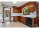 Traditional kitchen boasts wooden cabinets and access to another room at 1940 12Th Ne St, Hickory, NC 28601