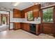 Classic kitchen with wooden cabinets, white countertops, and a black dishwasher at 1940 12Th Ne St, Hickory, NC 28601