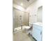 Modern bathroom featuring a tiled shower with a glass enclosure and vanity with sleek fixtures at 2019 Tears Ln, Charlotte, NC 28217