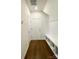 Entryway boasts hardwood floors, built-in bench with storage, and coat hooks for organized living at 2019 Tears Ln, Charlotte, NC 28217