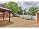 Backyard showcasing a hot tub, gazebo, wooden deck, and white fence, ideal for outdoor relaxation at 2036 1St Sw Ave, Hickory, NC 28602