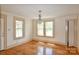 Bright, empty room with hardwood floors, large windows, and neutral wall tones, ready for customization at 2036 1St Sw Ave, Hickory, NC 28602