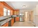 A spacious kitchen with stainless steel appliances, wooden cabinets, and a double basin sink at 2036 1St Sw Ave, Hickory, NC 28602