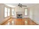 Inviting living room with hardwood floors, a classic fireplace, and windows, offering a comfortable atmosphere at 2036 1St Sw Ave, Hickory, NC 28602