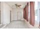 This living room has ceramic tile flooring, a ceiling fan, and natural light from the windows at 2036 1St Sw Ave, Hickory, NC 28602