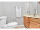 Cozy bathroom featuring a standard toilet, vanity with storage, and neutral wall color at 2045 Flushing Ct, Charlotte, NC 28215