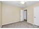 Bedroom showcasing neutral walls, carpet, a door and window, ready to be customized as desired at 2045 Flushing Ct, Charlotte, NC 28215