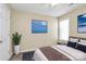 Cozy bedroom with ceiling fan and a picturesque window view, perfect for relaxation and unwinding at 2045 Flushing Ct, Charlotte, NC 28215