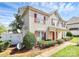 Well-maintained townhouse with vibrant red shutters and a tidy front yard at 2045 Flushing Ct, Charlotte, NC 28215
