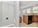 Small laundry area with washer hookups, and view into the kitchen and living room at 2045 Flushing Ct, Charlotte, NC 28215
