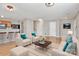 An inviting living room area, with stylish furniture, a kitchen in the background, and two entry doorways at 2045 Flushing Ct, Charlotte, NC 28215
