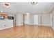 An open living room space with a kitchen in the background and a stairway to the upper level at 2045 Flushing Ct, Charlotte, NC 28215