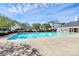 Large community pool surrounded by lush trees and well-maintained townhouses at 2045 Flushing Ct, Charlotte, NC 28215