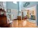 Spacious foyer featuring high ceilings, gleaming hardwood floors, and an open view to the living room at 21216 Norman Shores Dr, Cornelius, NC 28031