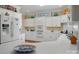 Bright kitchen showcasing white cabinetry, built-in appliances, and ample counter space at 21216 Norman Shores Dr, Cornelius, NC 28031