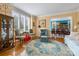 Cozy living room with hardwood floors, large windows, and elegant furnishings at 21216 Norman Shores Dr, Cornelius, NC 28031