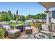 Outdoor living space with ample seating area, built-in bar, and well-maintained lawn at 2322 Tessa Trce, Clover, SC 29710
