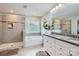 Bathroom with a glass shower, soaking tub, and granite countertop vanity with dual sinks at 2322 Tessa Trce, Clover, SC 29710
