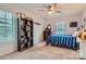 Bright bedroom features a ceiling fan, carpeted floors, and a window offering plenty of natural light at 2322 Tessa Trce, Clover, SC 29710
