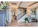 Inviting foyer with wood floors, staircase, and decorative accents leading to an office and living area at 2322 Tessa Trce, Clover, SC 29710
