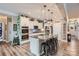 Modern kitchen with white cabinetry, granite countertops, a large island, and stainless steel appliances at 2322 Tessa Trce, Clover, SC 29710