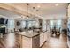 Open-concept kitchen boasts granite countertops, an island, and seamless flow into the living and dining areas at 2322 Tessa Trce, Clover, SC 29710